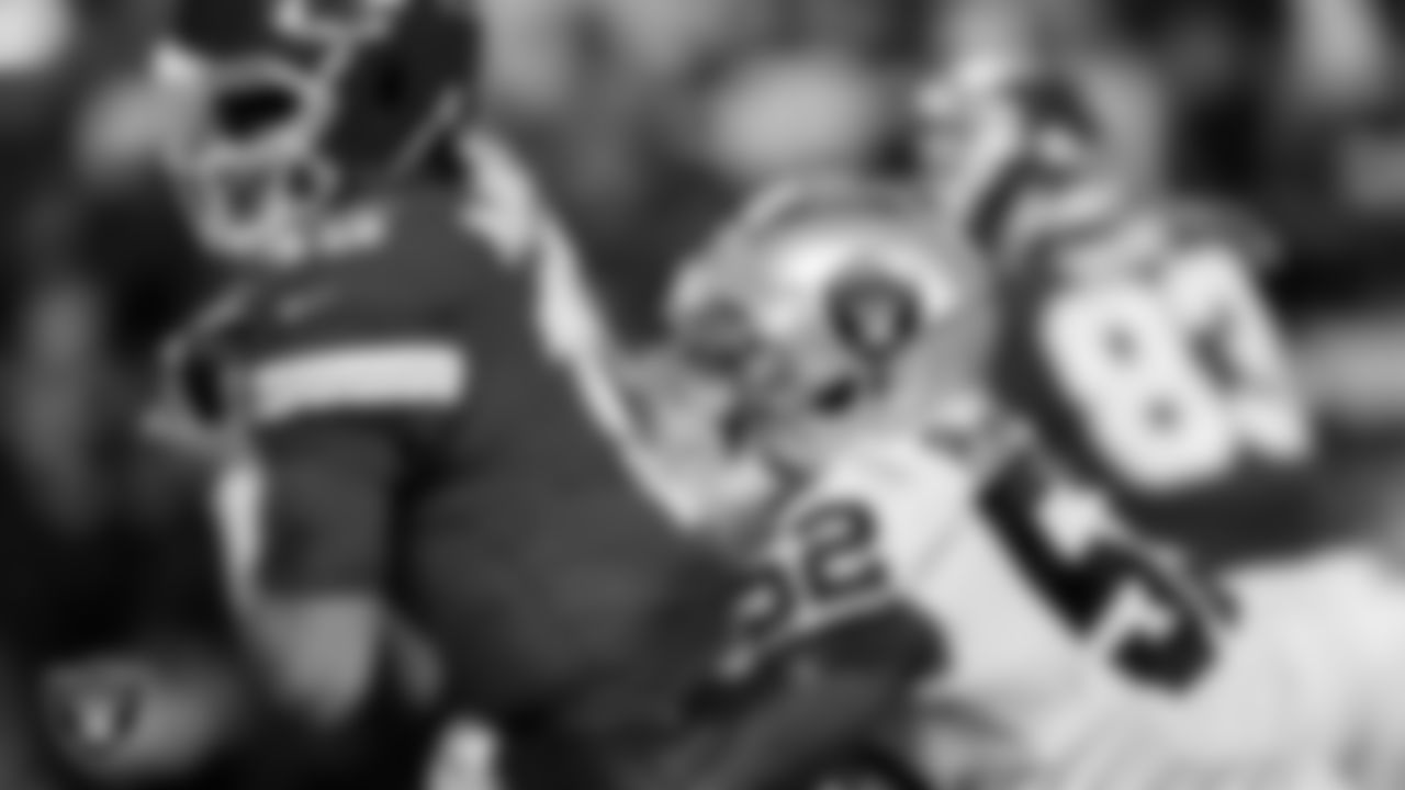 Las Vegas Raiders linebacker Denzel Perryman (52) sacks the quarterback during the regular season away game against the Kansas City Chiefs at GEHA Field at Arrowhead Stadium.
