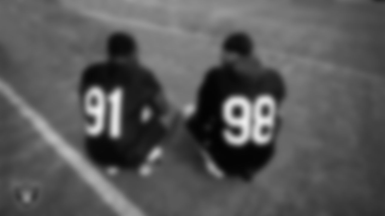 Las Vegas Raiders defensive end Yannick Ngakoue (91) and defensive end Maxx Crosby (98) on the field for practice at 2021 Training Camp.