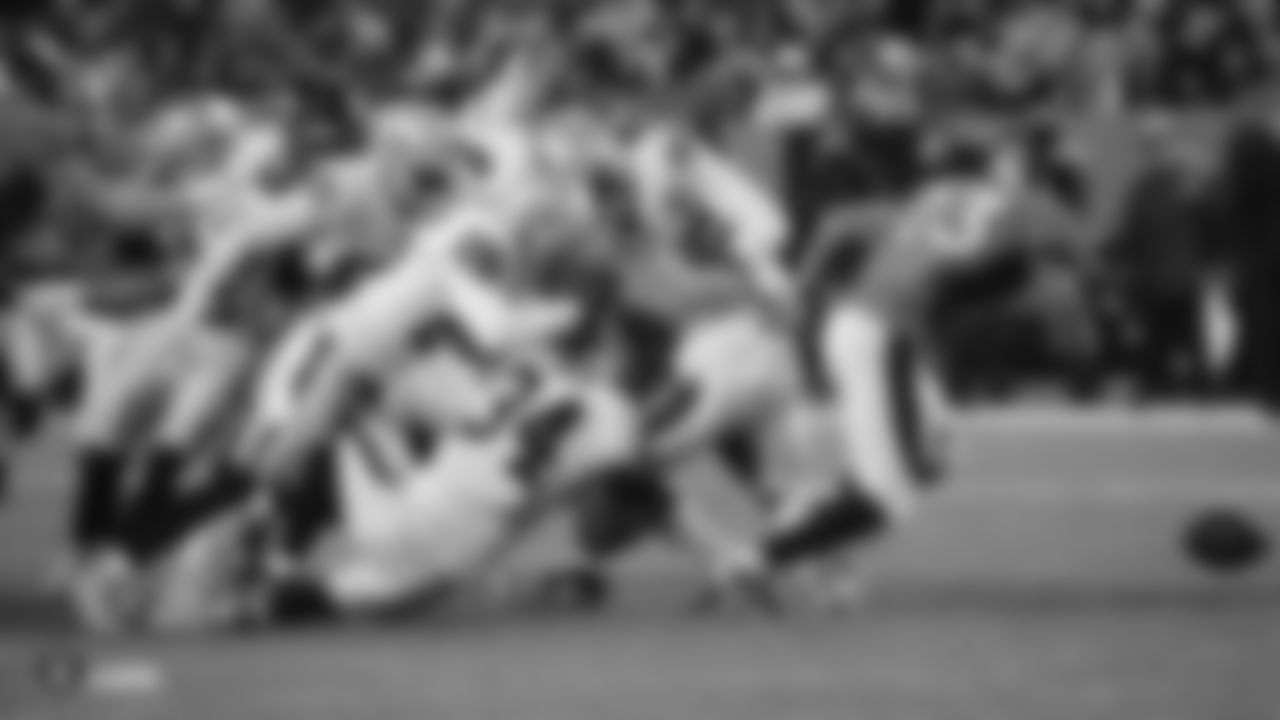 The Raiders during the regular season game against the Denver Broncos at Empower Field at Mile High.