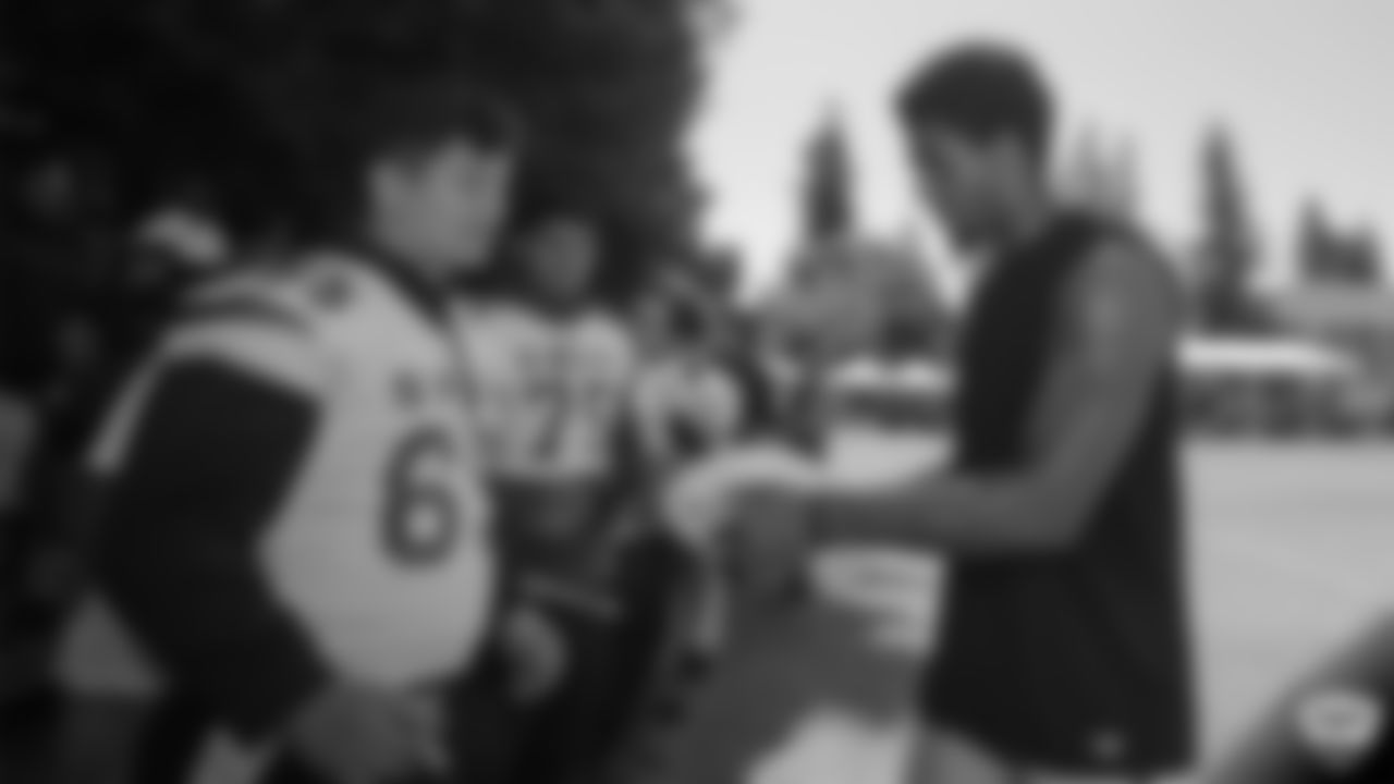 Raiders wide receiver Tyrell Williams (16) signs autographs at a joint practice with the Los Angeles Rams at 2019 Training Camp.