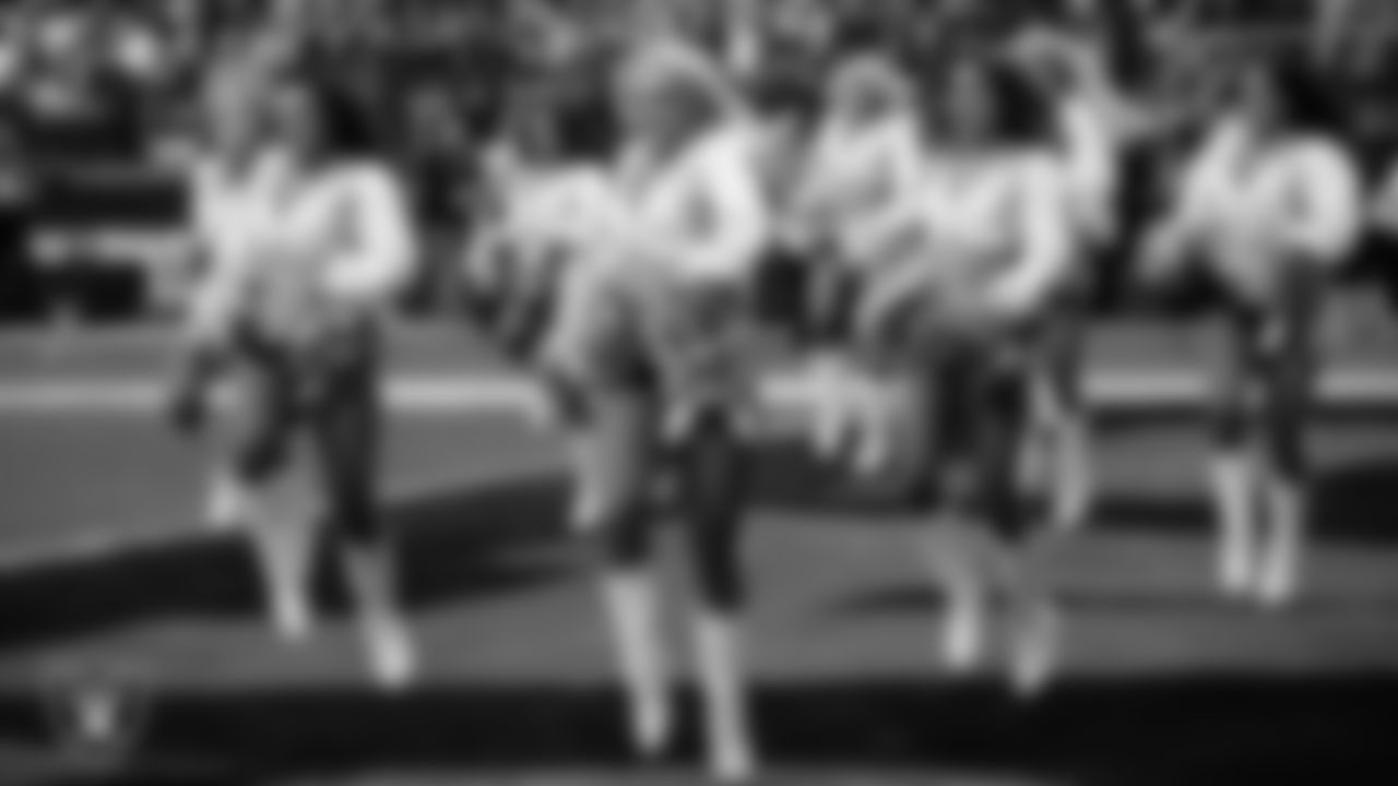 Raiderette Claudia walks onto the field for a performance during the regular season home game against the Los Angeles Chargers at Allegiant Stadium.