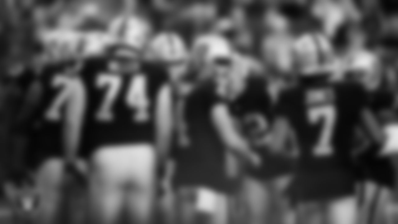 The Las Vegas Raiders offense huddles during the regular season home game against the Denver Broncos.