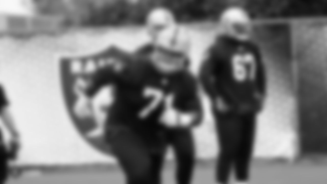 Raiders tackle Denzelle Good (71) on the field for practice.