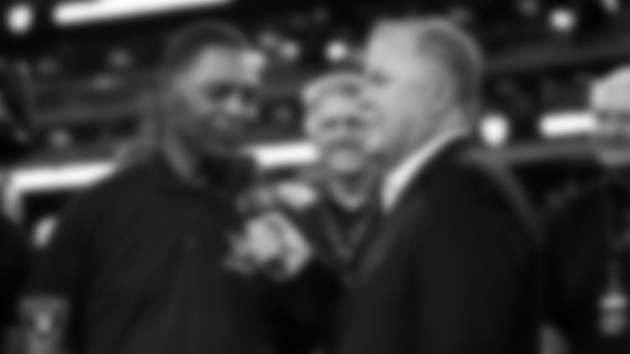 Las Vegas Raiders alumnus Marcus Allen is interviewed by broadcaster JT the Brick on the field during an alumni celebration at halftime of the Raiders' preseason home game against the New England Patriots at Allegiant Stadium.