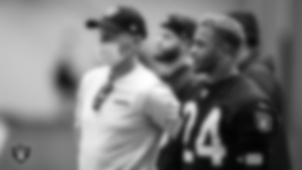 Las Vegas Raiders General Manager Mike Mayock and safety Johnathan Abram (24) during practice.