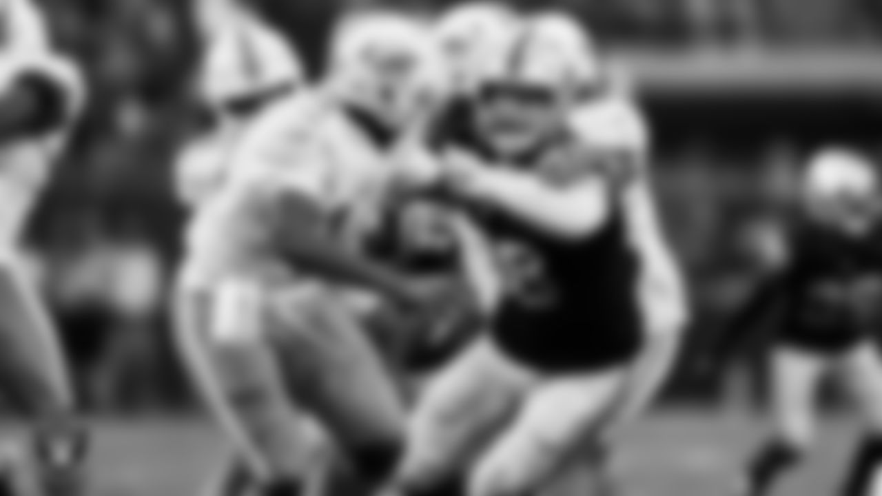 Las Vegas Raiders defensive end Maxx Crosby (98) pressures the quarterback during the regular season home game against the Miami Dolphins.