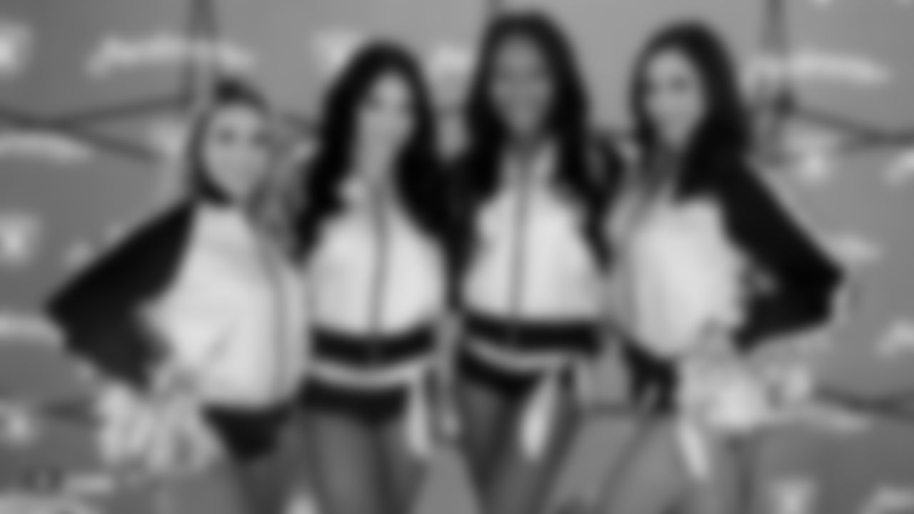 Raiderettes Julia, Audrey, Vanecia, and June pose for a photo during a lunch hosted by the Raiders front office for construction workers of the Raiders Headquarters and Intermountain Healthcare Performance Center.
