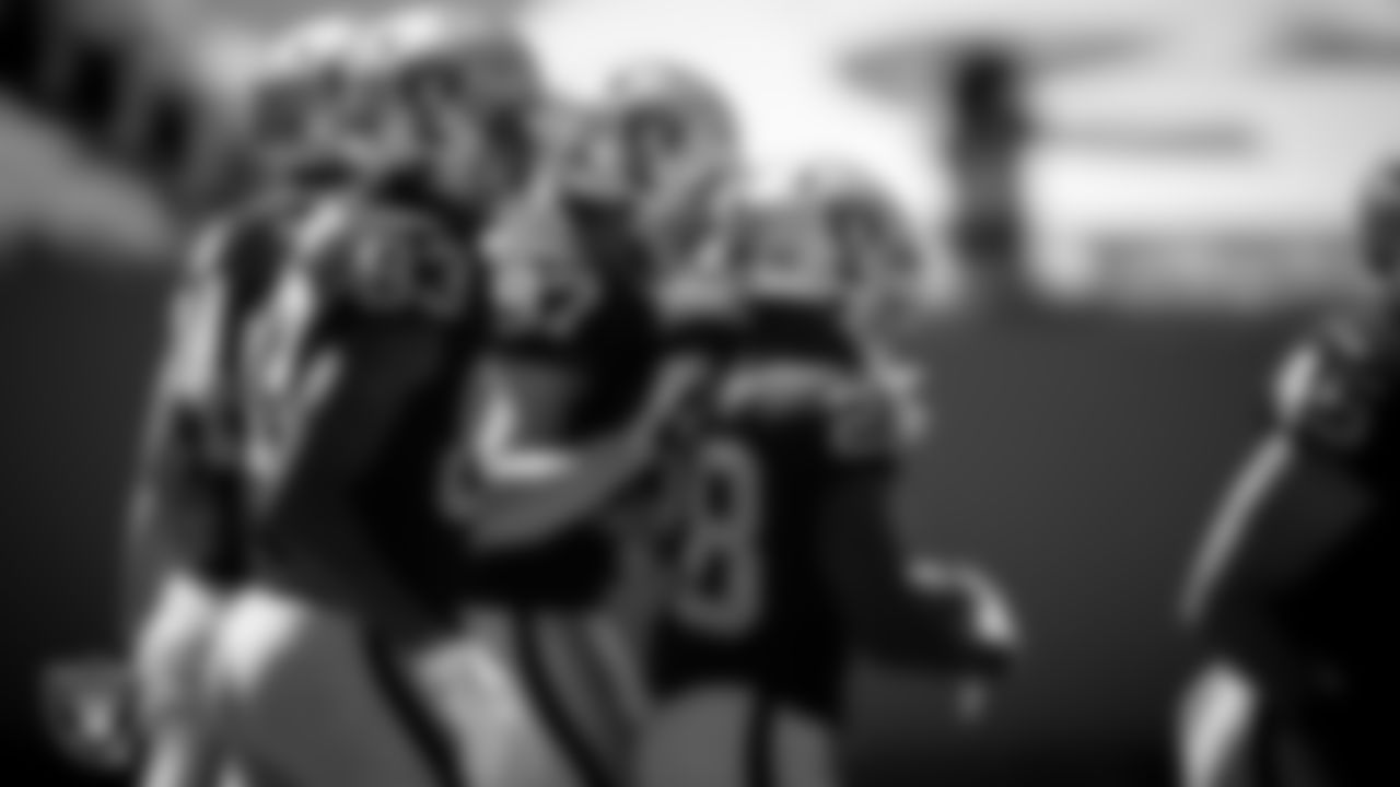 Las Vegas Raiders running back Josh Jacobs (28) is congratulated by tight end Foster Moreau (87) after rushing for a 1-yard touchdown during the regular season away game against the Carolina Panthers.