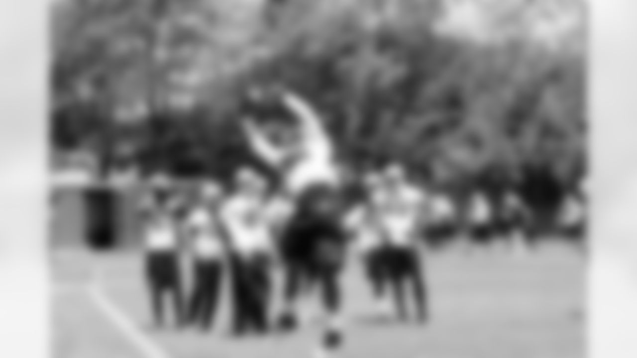 WR Juron Criner goes up to make the catch.