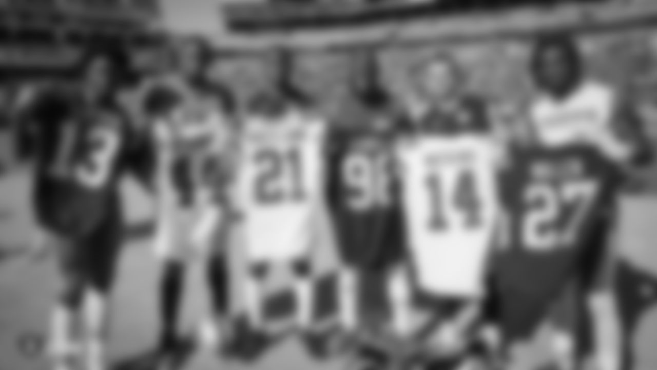 Raiders defensive end Clelin Ferrell (96), cornerback Trayvon Mullen (27), and wide receiver Hunter Renfrow (13) swap jerseys with Kansas City Chiefs linebacker Dorian O'Daniel (44), cornerback Bashaud Breeland (21), and wide receiver Sammy Watkins (14) after the Raiders regular game against the Kansas City Chiefs.