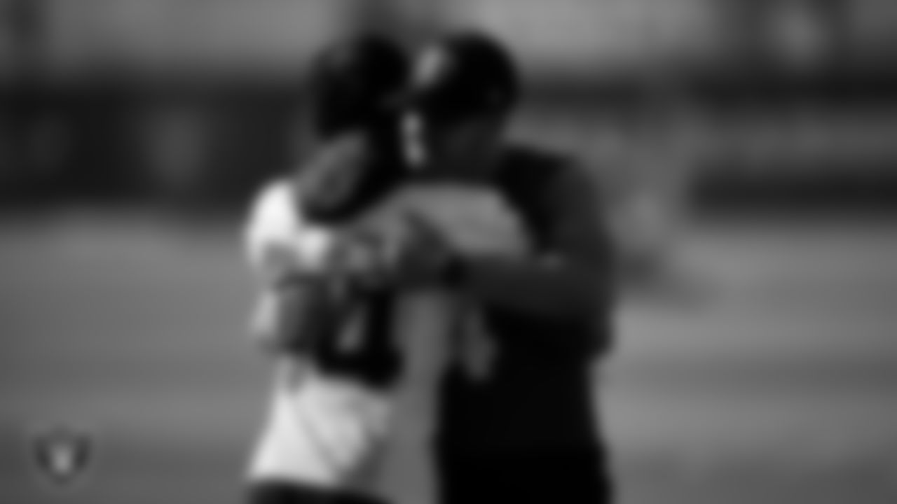 Las Vegas Raiders wide receiver Tyron Johnson (84) and quarterback Derek Carr (4) at a workout during phase two of the offseason program.