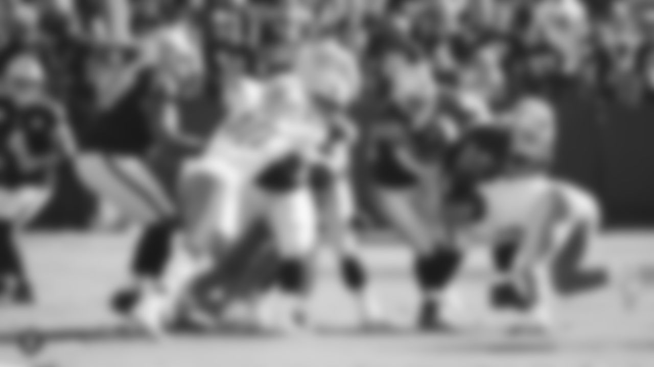 Raiders running back Josh Jacobs (28) rushes during the regular season game against the Detroit Lions.