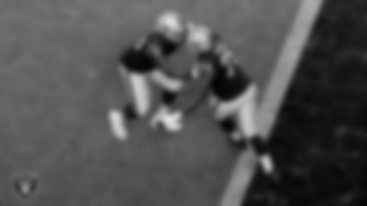 The Raiders warm up before the regular season game against the Denver Broncos at Allegiant Stadium.