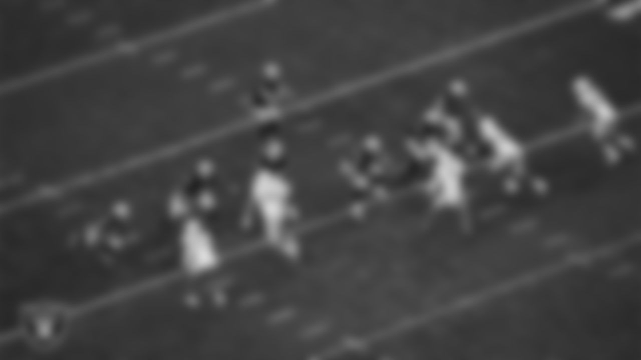 Las Vegas Raiders quarterback Derek Carr (4) receives the snap during the regular season home game against the Los Angeles Chargers at Allegiant Stadium.