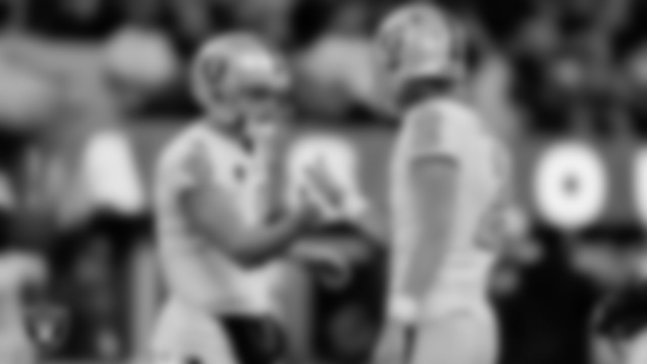 Las Vegas Raiders kicker Daniel Carlson (2) is congratulated by quarterback Derek Carr (4) after kicking a 31-yard field goal during the regular season away game against the Los Angeles Rams at SoFi Stadium.