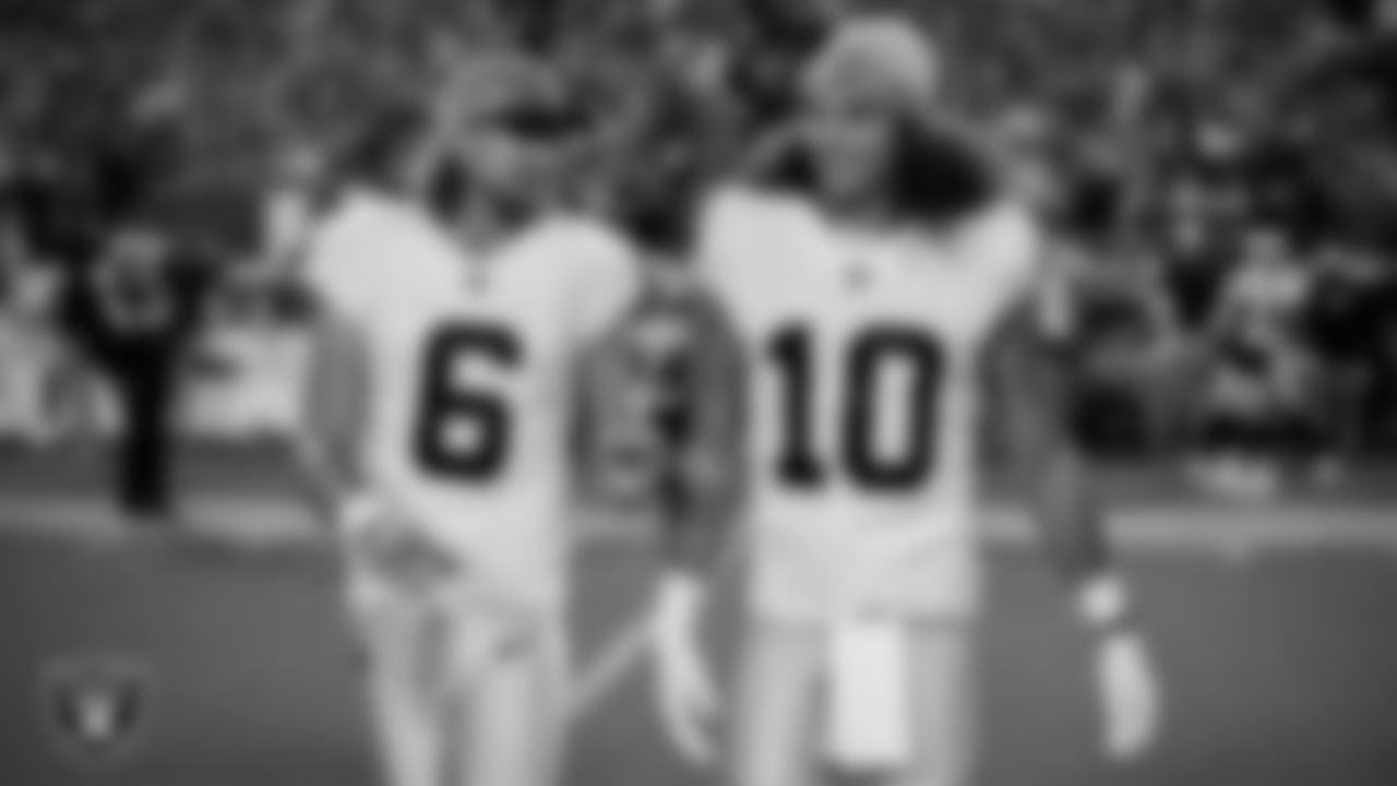 Las Vegas Raiders punter AJ Cole (6) and wide receiver Mack Hollins (10) walk out to the center of the field for the coin toss before the regular season away game against the the Kansas City Chiefs at GEHA Field at Arrowhead Stadium.