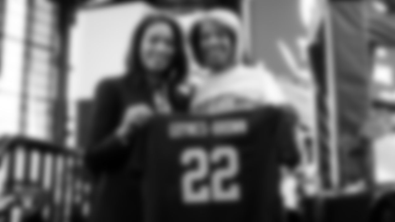 Las Vegas Raiders President Sandra Douglass Morgan presents a Raiders jersey to North Las Vegas Mayor, Pamela Goynes-Brown, before the regular season home game against the New England Patriots at Allegiant Stadium.