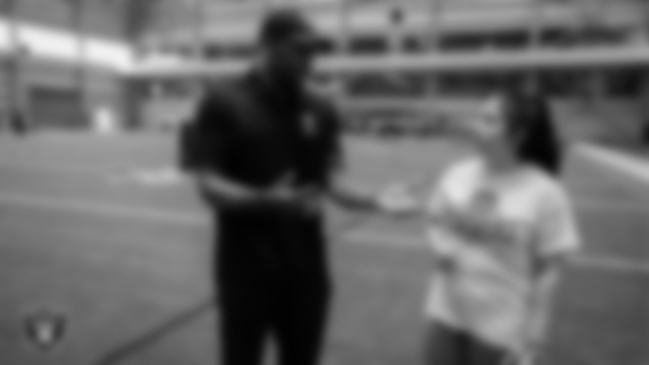 Las Vegas Raiders alumnus Korey Toomer works with an athlete as they participate in drills during the ELITE Academy at the Las Vegas Raiders Headquarters.