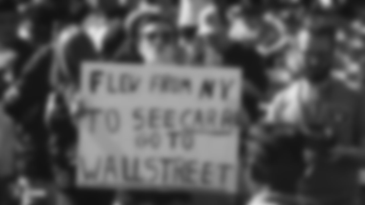 A fan holds up a sign for Oakland Raiders quarterback Derek Carr before an NFL football game between the Raiders and the Detroit Lions in Oakland, Calif., Sunday, Nov. 3, 2019. (AP Photo/John Hefti)