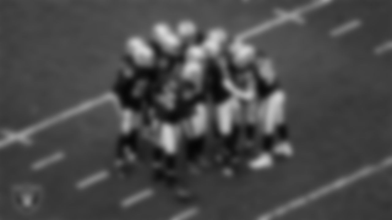 The Las Vegas Raiders defense huddles during the regular season home game against the Houston Texans at Allegiant Stadium.