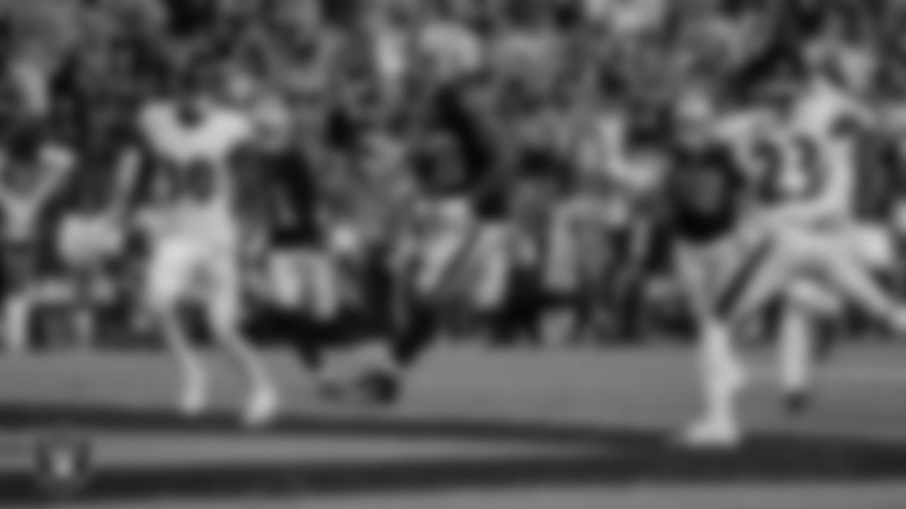 Las Vegas Raiders running back Josh Jacobs (28) rushes for a 15-yard touchdown during the regular season game against the Baltimore Ravens at Allegiant Stadium.