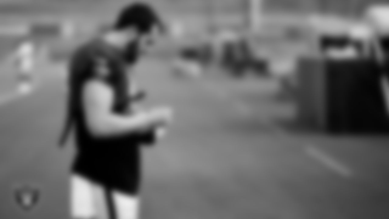 Las Vegas Raiders quarterback Derek Carr (4) signs an autograph during a joint practice with the Los Angeles Rams at 2021 Training Camp.