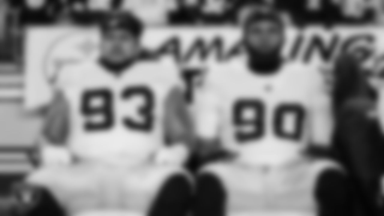 Las Vegas Raiders defensive tackle Kyle Peko (93) and defensive lineman Jerry Tillery Jr. (90) on the bench before the regular season away game against the Pittsburgh Steelers at Acrisure Stadium.