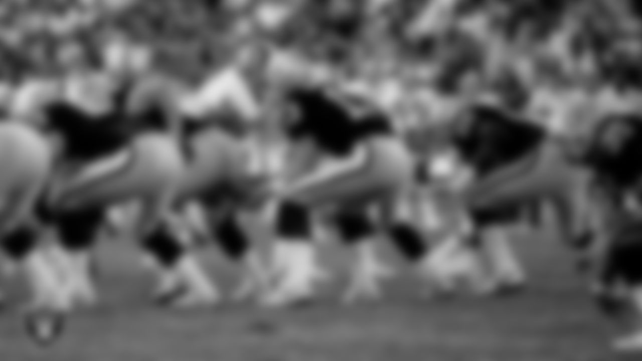 Los Angeles Raiders quarterback Jay Schroeder (13) receives the snap during the regular season home game against the Washington Football Team at Los Angeles Memorial Coliseum, Sunday, October 29, 1989, in Los Angeles, Calif.