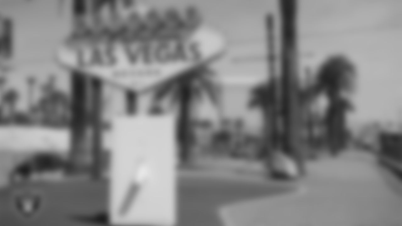 A light switch in front of the "Welcome to Fabulous Las Vegas" sign before it was lit up silver and black.