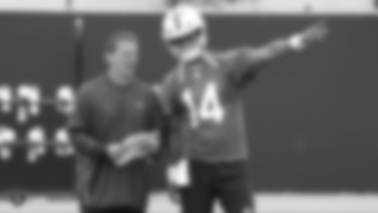 Raiders offensive coordinator Greg Olson and quarterback DeShone Kizer (14) on the field for practice.