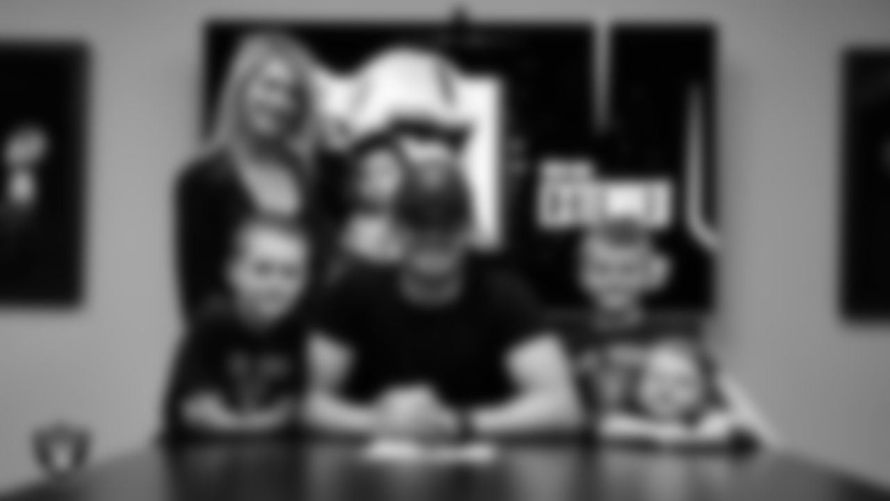 Las Vegas Raiders quarterback Derek Carr (4) with his family after signing a contract extension.