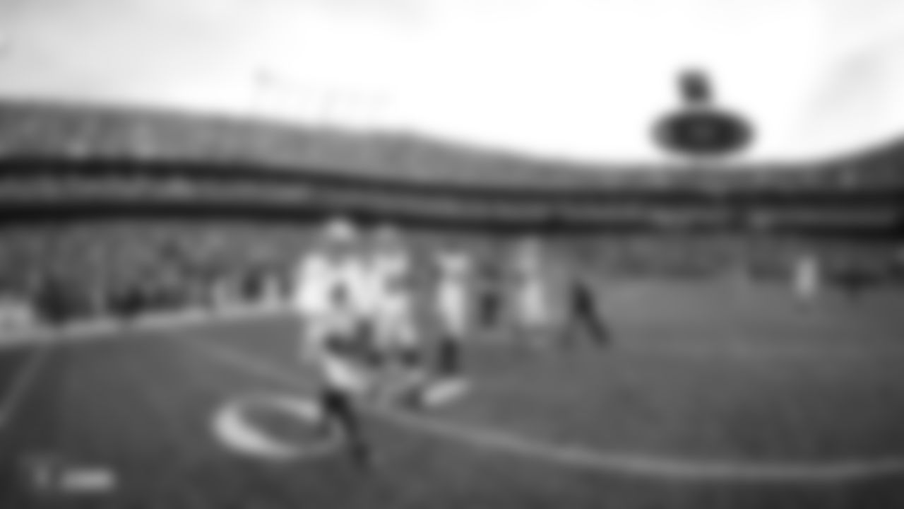 Oakland Raiders quarterback Derek Carr (4), linebacker Kyle Wilber (58), center Rodney Hudson (61), and defensive tackle Frostee Rucker (98) walk out to the center of the field for the coin toss before the Oakland Raiders regular season game against the the Kansas City Chiefs at Arrowhead Stadium, Sunday, December 30, 2018, in Kansas City, Missouri. The Oakland Raiders lost 35-3.