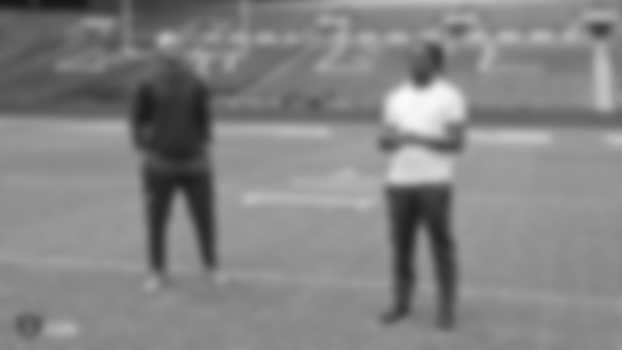 Oakland Raiders linebacker Kyle Wilber (58) and safety Reggie Nelson (27) on the field for a walk through before their game against the Seattle Seahawks, Saturday, October 13, 2018, in London, England.