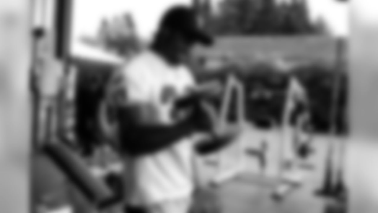 RB Taiwan Jones lifts weights during conditioning.