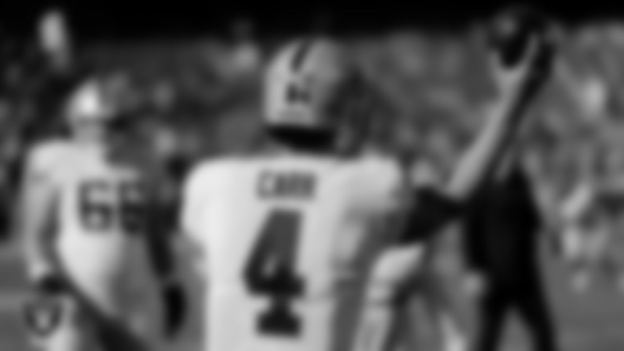 Las Vegas Raiders quarterback Derek Carr (4) warming up before the regular season away game against the Kansas City Chiefs at Arrowhead Stadium.
