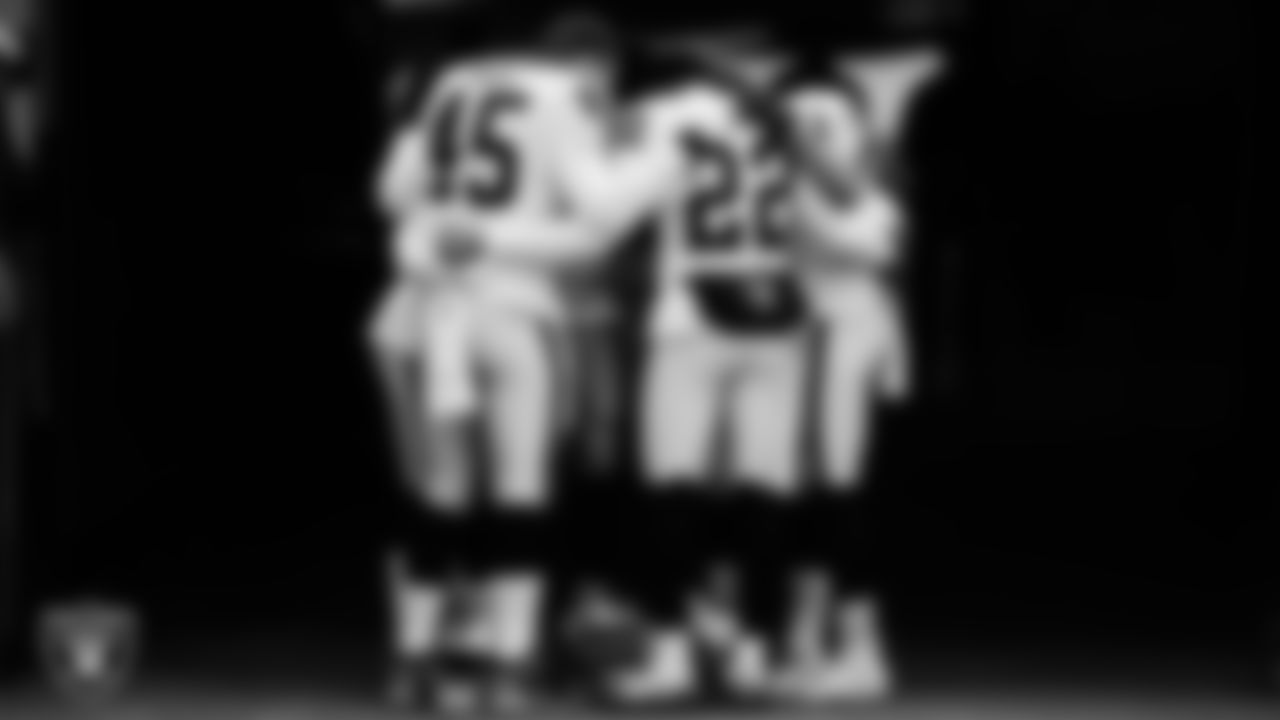 The Las Vegas Raiders special teams returners huddle in the tunnel before the regular season away game against the Denver Broncos.