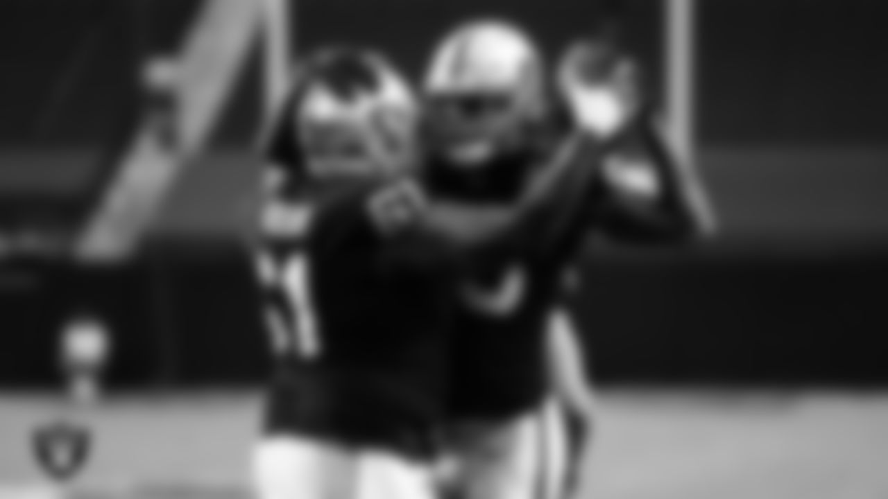 Las Vegas Raiders tight end Darren Waller (83) is congratulated by center Rodney Hudson (61) after making a 1-yard touchdown catch during the regular season home game against the Tampa Bay Buccaneers.