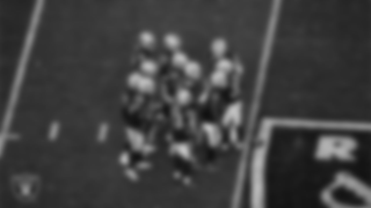 The Las Vegas Raiders defense huddles during the regular season home game against the San Francisco 49ers at Allegiant Stadium.