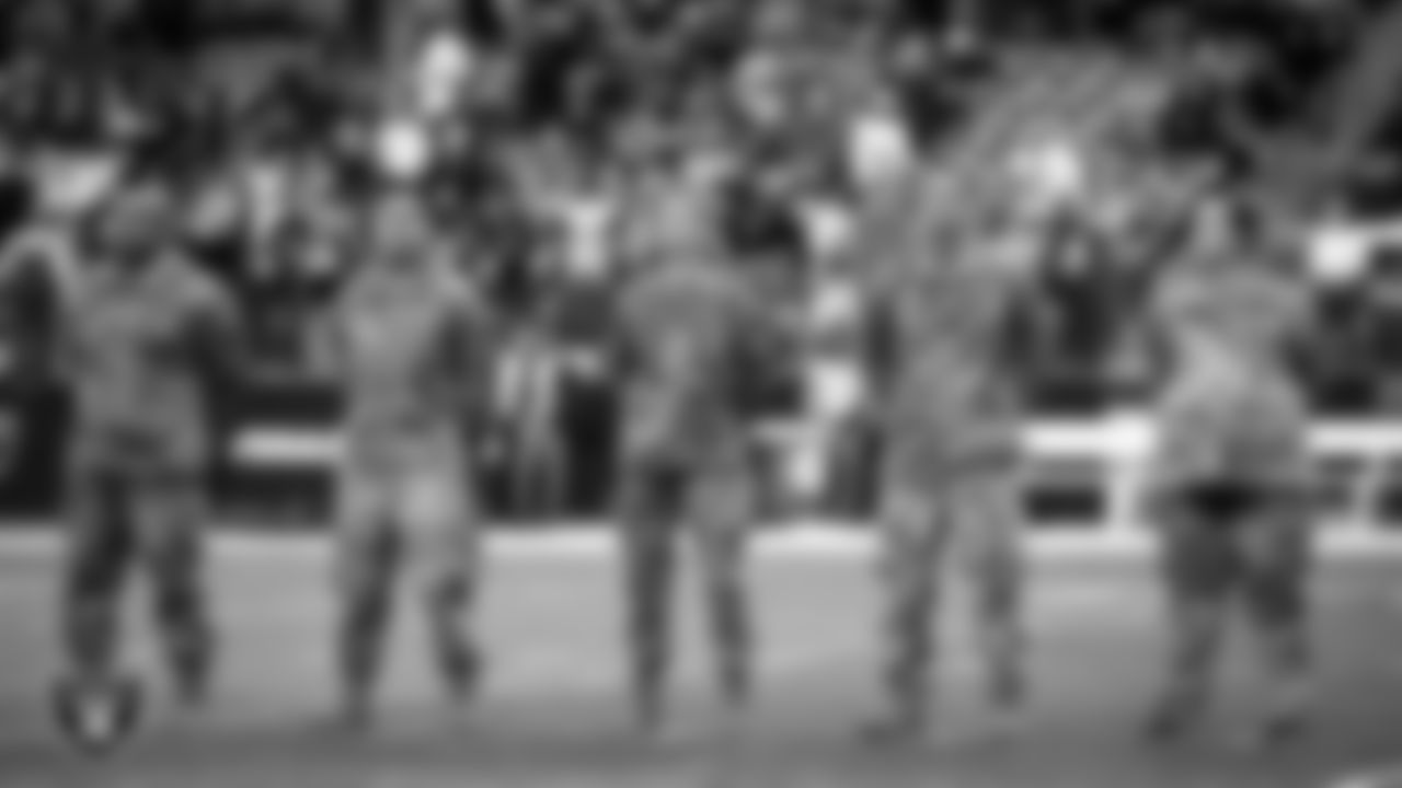 Members of the United States Air Force take part in a reenlistment ceremony before the Las Vegas Raiders' regular season home game against the Cincinnati Bengals.