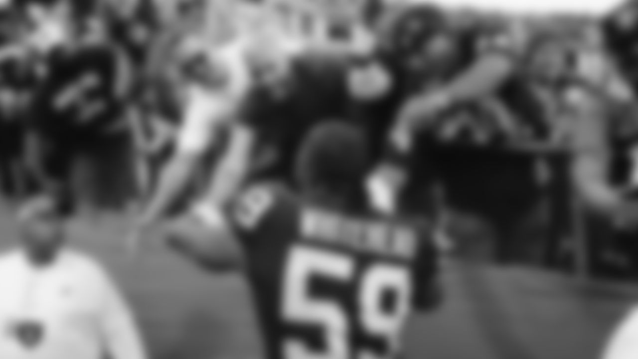 Raiders linebacker Tahir Whitehead (59) celebrates with fans after the regular season game against the Detroit Lions.