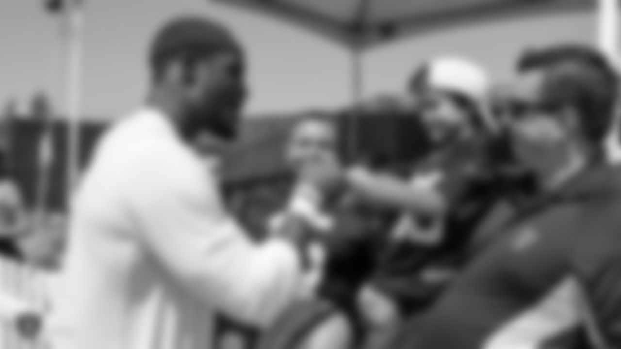 Oakland Raiders linebacker Tahir Whitehead (59) signs autographs for fans after practice at 2018 Training Camp at The Oakland Raiders Napa Valley Training Complex, Monday, August 13, 2018, in Napa, California.