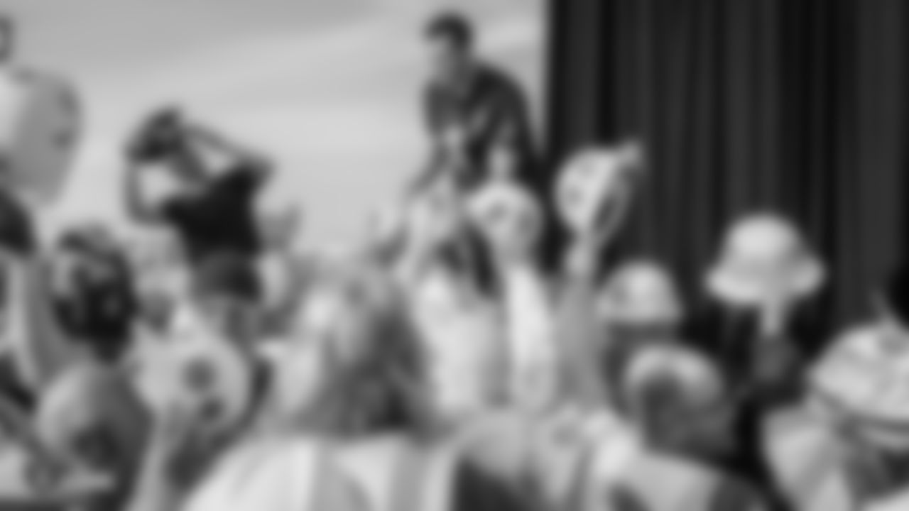Raiders quarterback Derek Carr (4) signs autographs for construction workers following an official announcement of the Raiders changing their name to the Las Vegas Raiders.