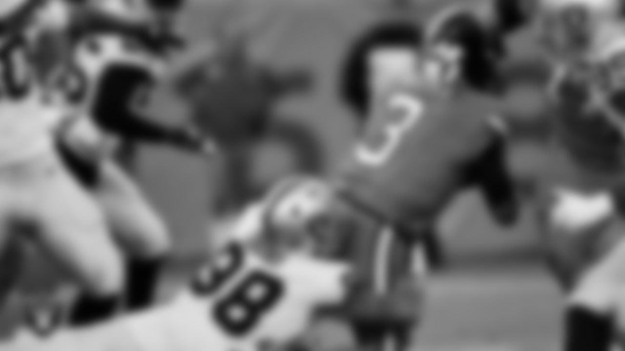 Las Vegas Raiders defensive end Maxx Crosby (98) sacks the quarterback during the regular season away game against the Denver Broncos at Empower Field at Mile High.