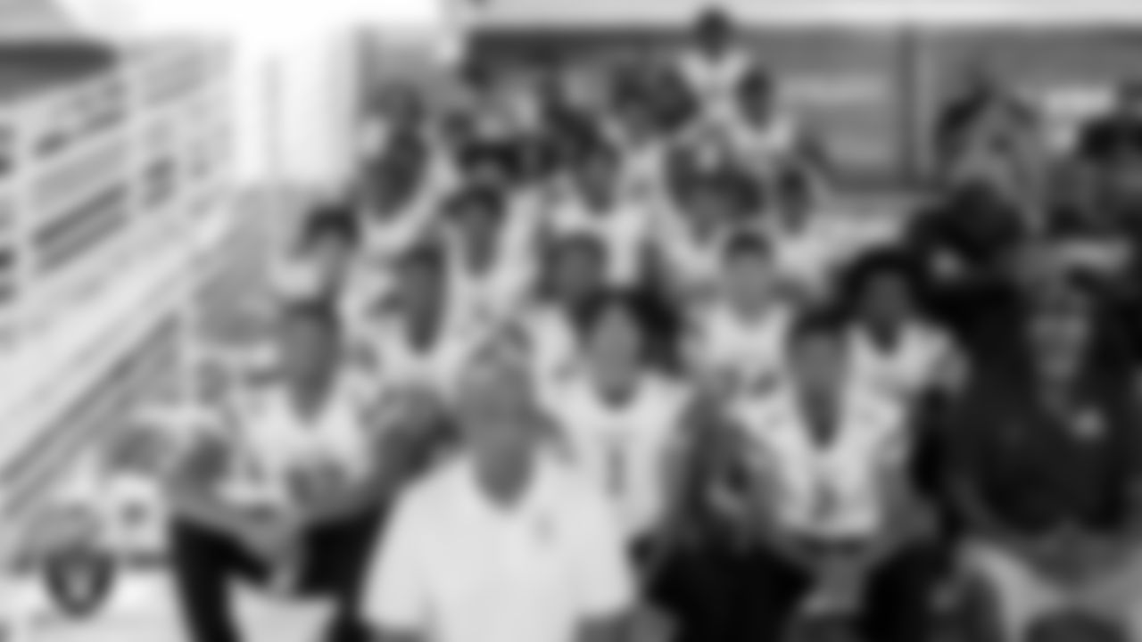 The Democracy Preparatory Academy at Agassi Campus Football Team in the stands at 2022 Training Camp at Intermountain Healthcare Performance Center.