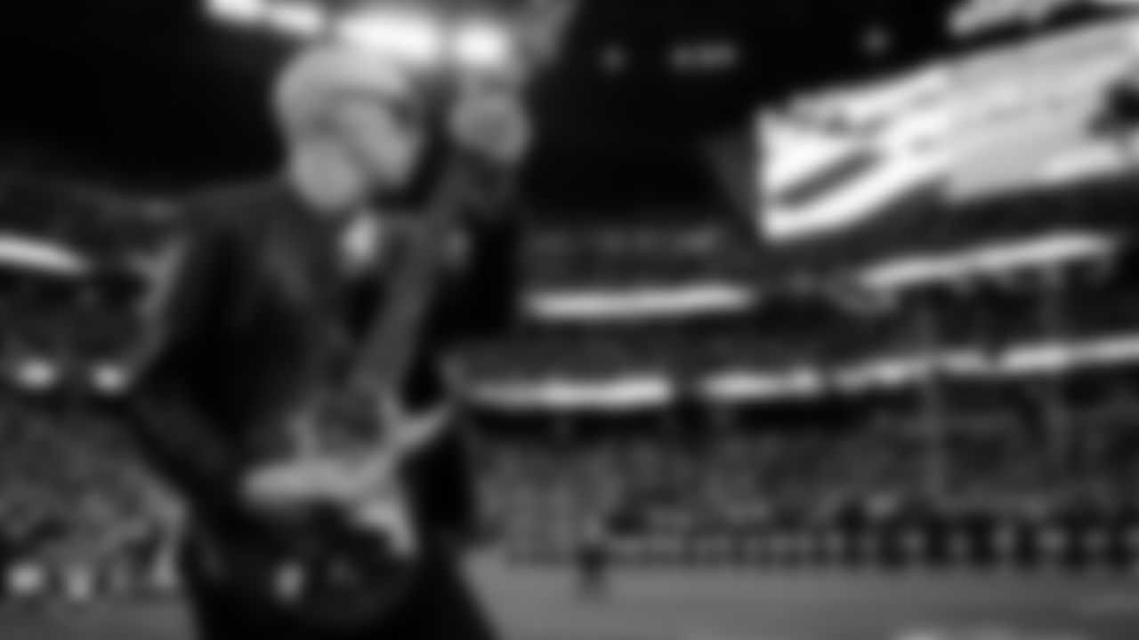 Guitarist and songwriter Joe Satriani performs the national anthem before the Las Vegas Raiders' regular season home game against the San Francisco 49ers at Allegiant Stadium.