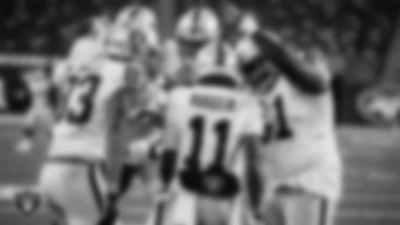 Las Vegas Raiders wide receiver Henry Ruggs III (11) celebrates with teammates after making a game winning 46-yard touchdown catch during the regular season away game against the New York Jets.