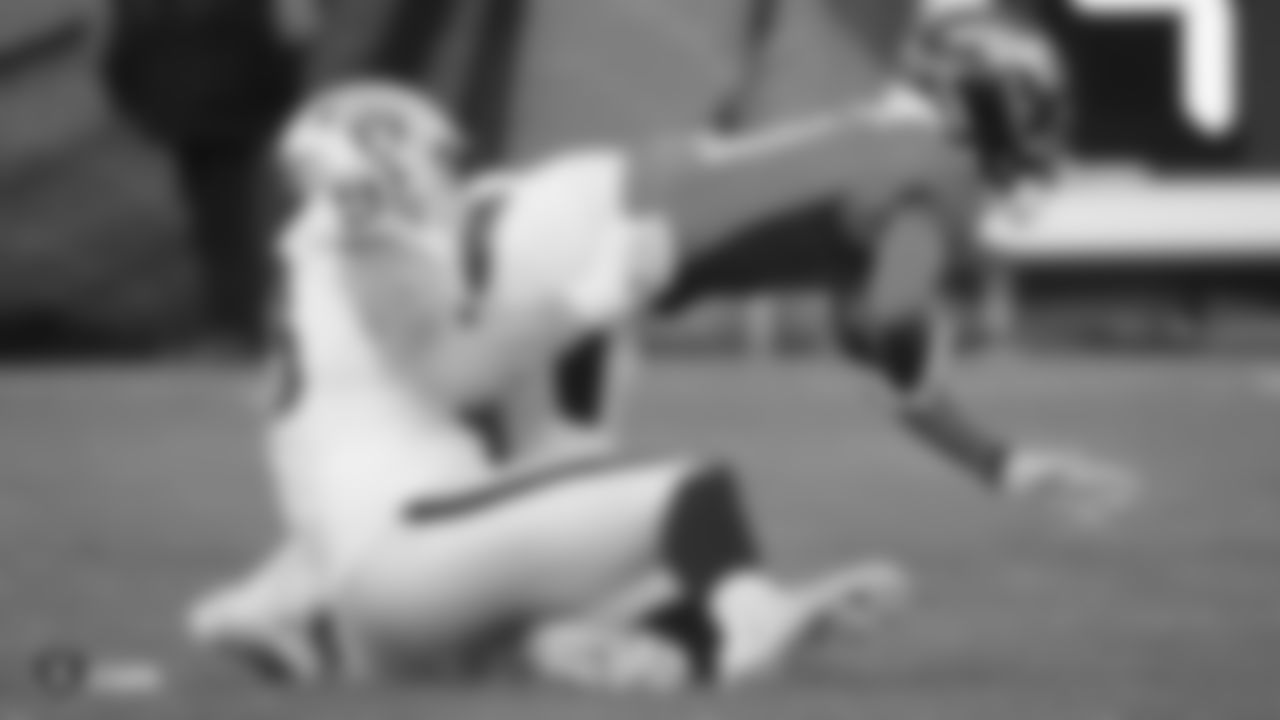 The Raiders during the regular season game against the Denver Broncos at Empower Field at Mile High.