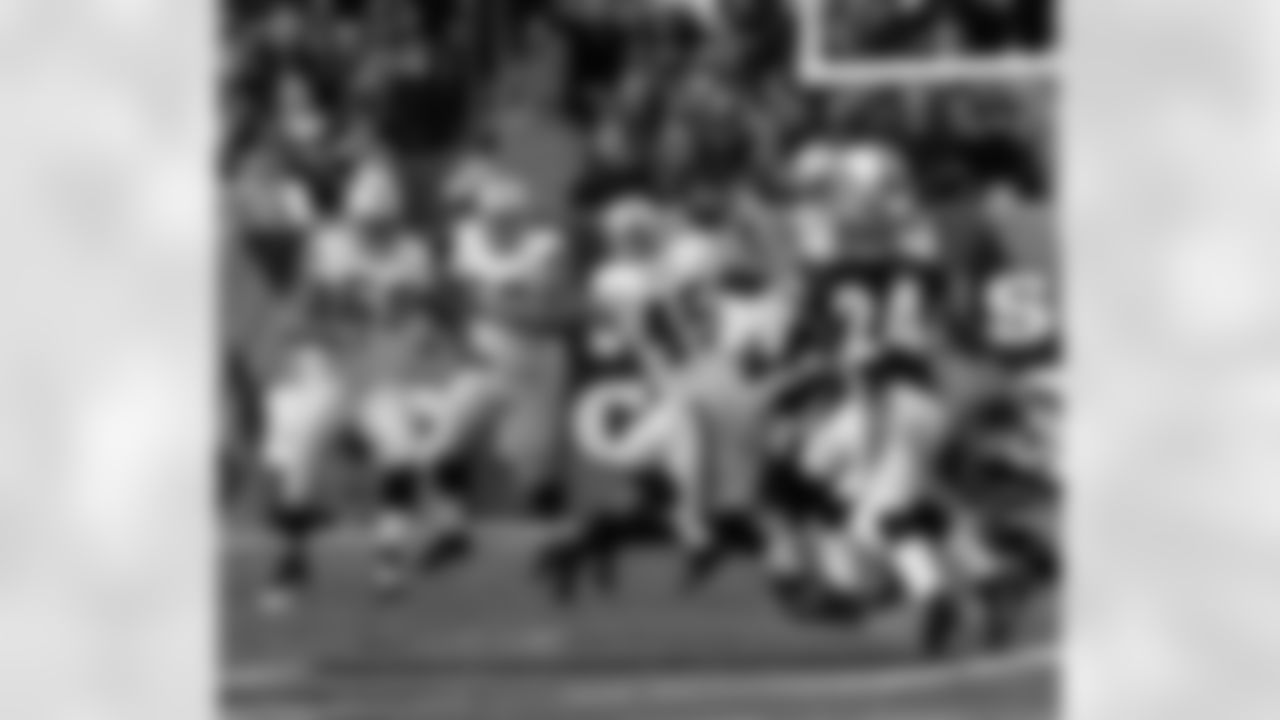 QB Carson Palmer dumps the ball off as he's getting tackled to RB Marcel Reece.