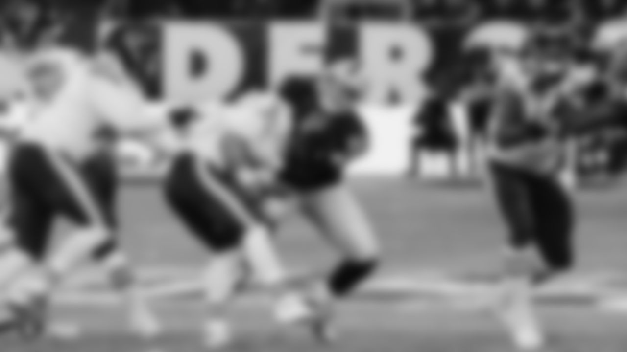 Raiders defensive end Maxx Crosby (98) sacks the quarterback during the regular season game against the Chicago Bears.