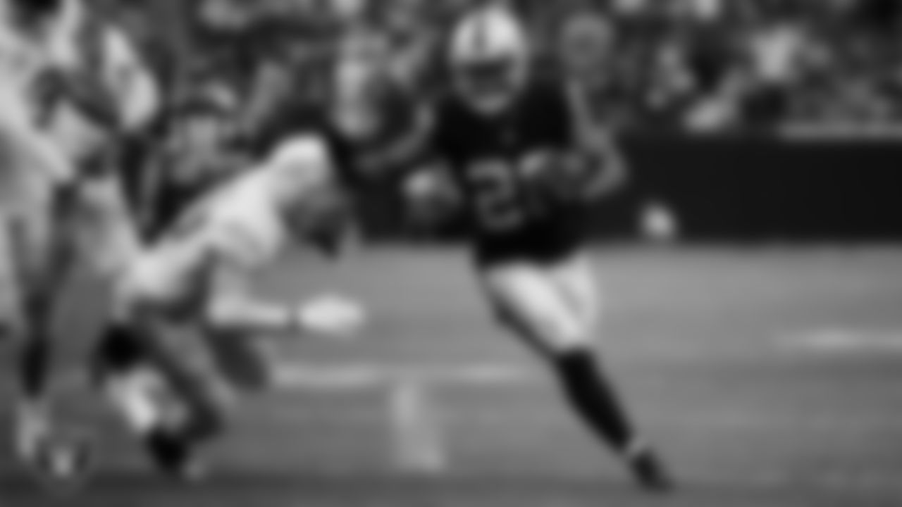 Las Vegas Raiders running back Josh Jacobs (28) rushes for a 20-yard touchdown during the regular season home game against the Los Angeles Chargers at Allegiant Stadium.